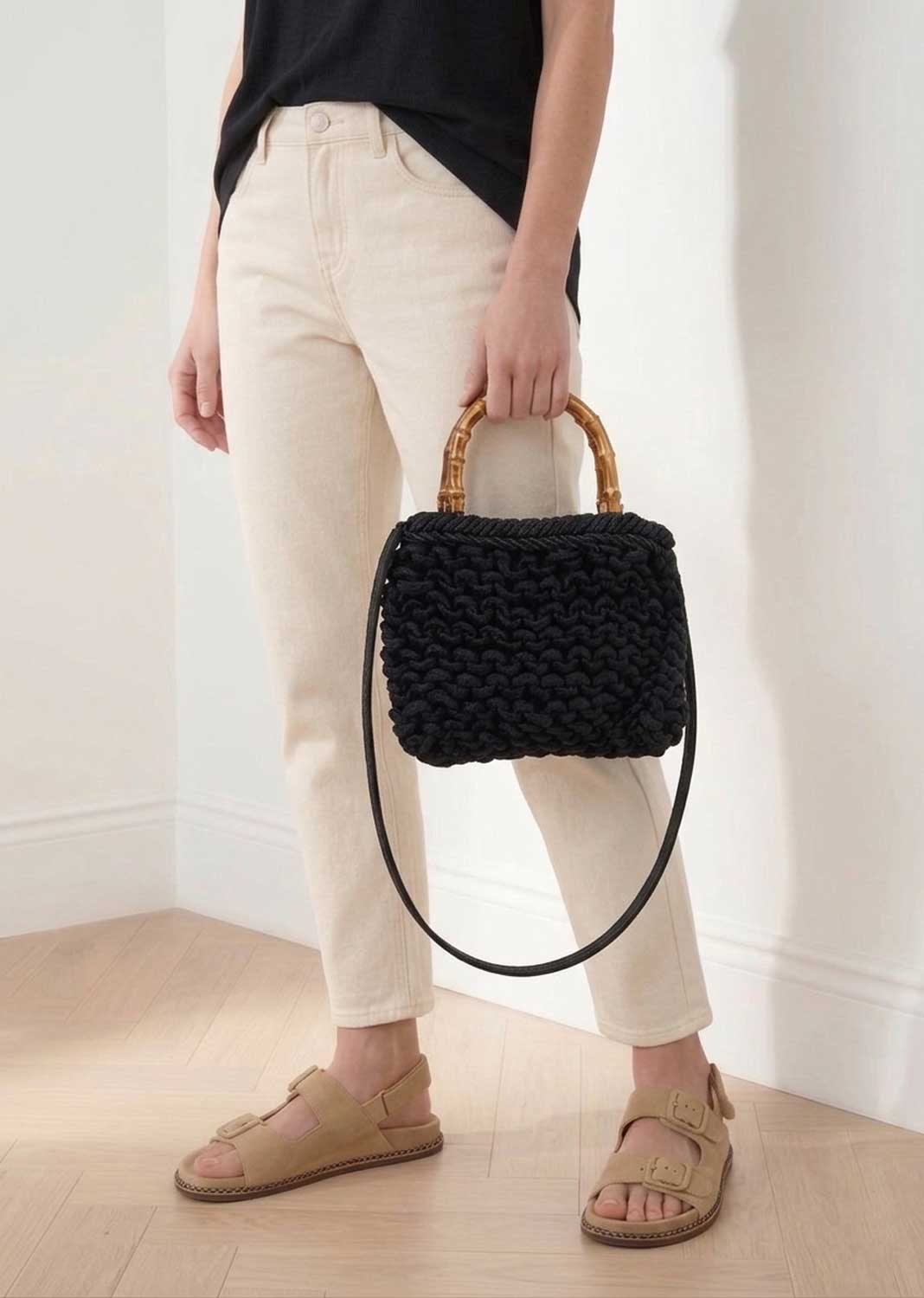 black woven crossbody bag with bamboo handle 