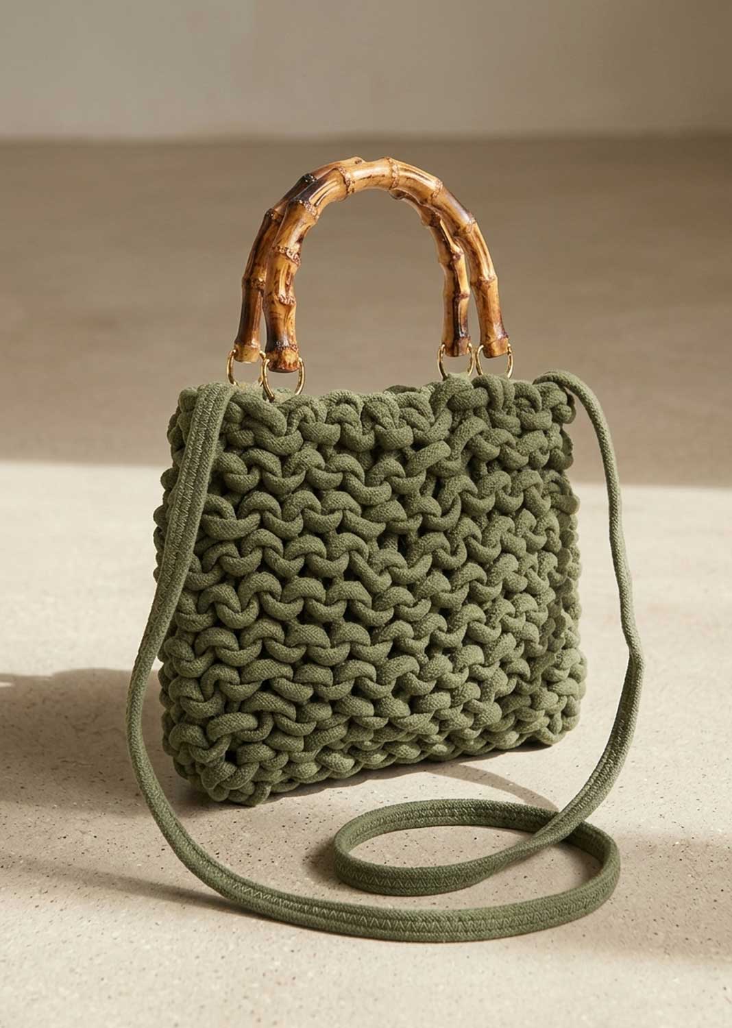 khaki woven crossbody bag with bamboo handle