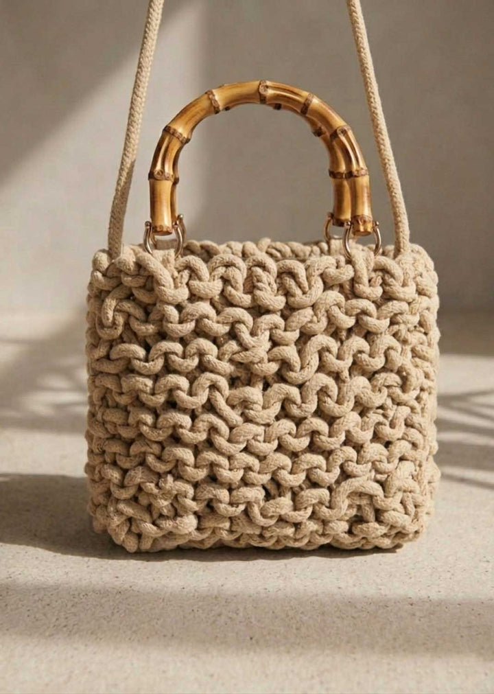 natural wovem crossbody bag with bamboo handle 