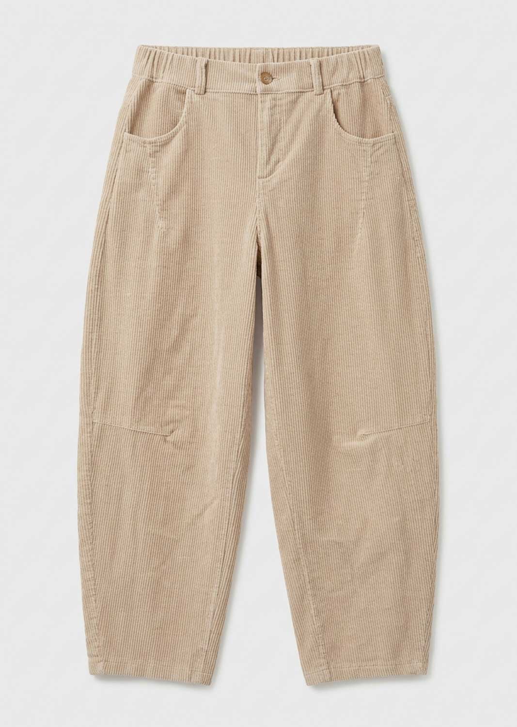 A pair of beige corduroy trousers with an elastic waistband, button closure, and front patch pockets, laid flat against a light gray background.