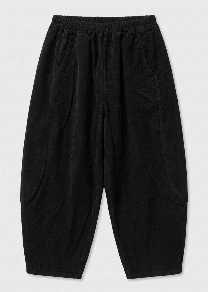 Black needlecord barrel leg pants with an elastic waistband, laid flat on a light gray background.