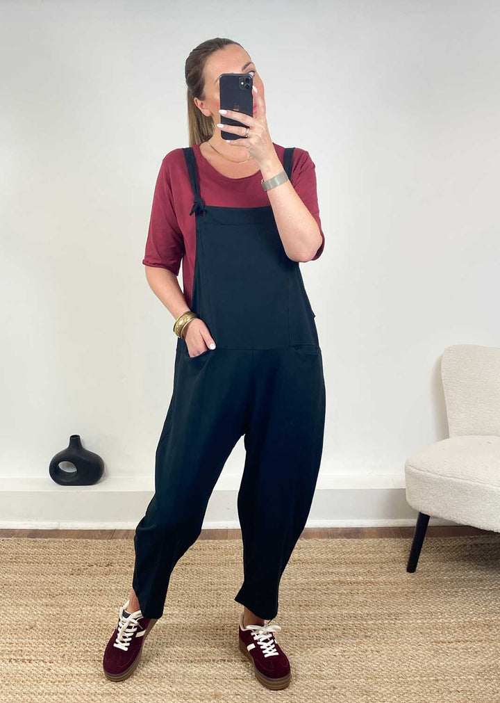 Black Jersey Dungarees and burgundy trainers