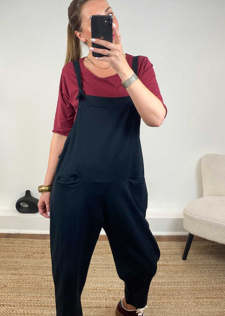 Black Jersey Dungarees and burgundy trainers