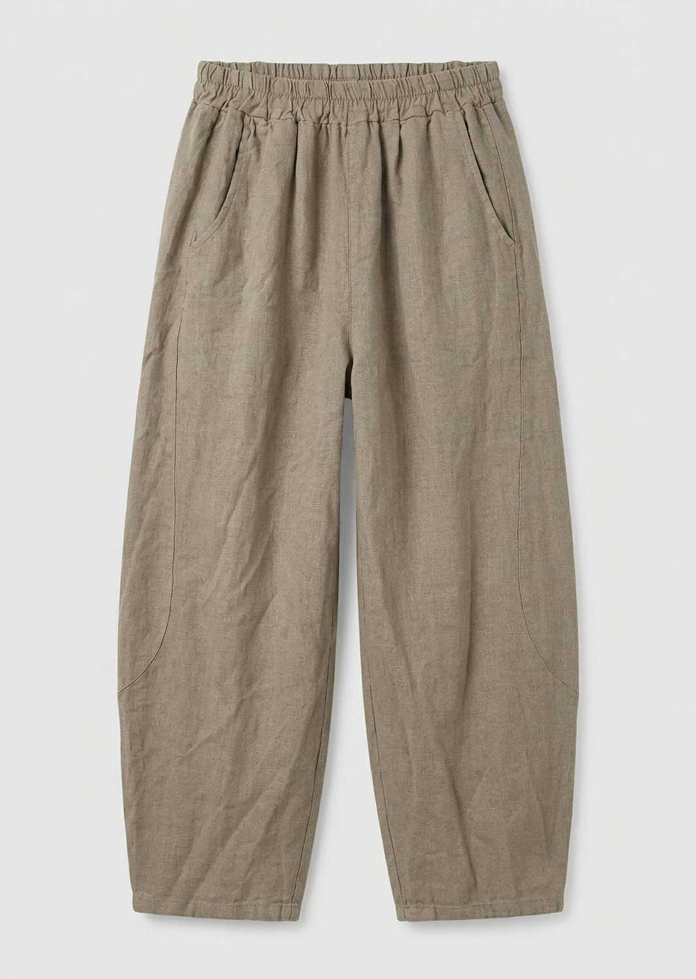 A pair of loose, wide-leg trousers in a textured taupe-beige fabric, featuring an elastic waistband and side pockets, shown flat on a light gray background.