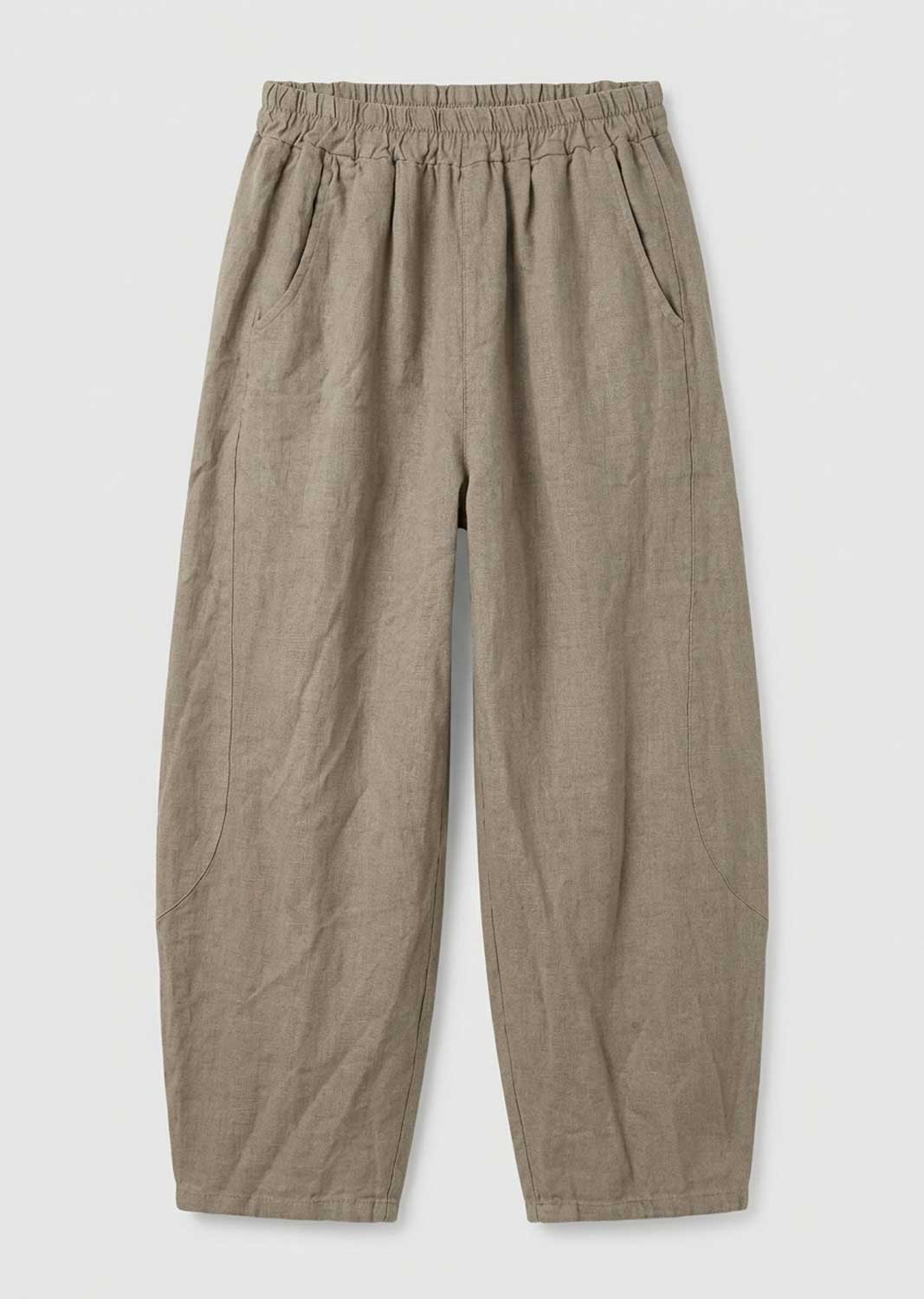 A pair of loose, wide-leg trousers in a textured taupe-beige fabric, featuring an elastic waistband and side pockets, shown flat on a light gray background.