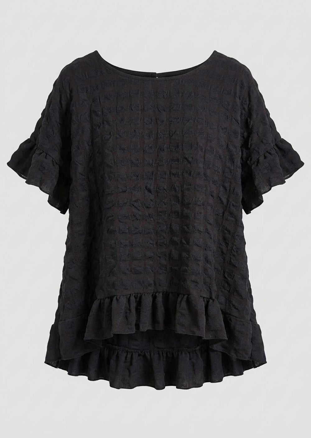 A black textured seersucker short-sleeve blouse with ruffled sleeves and a ruffled asymmetrical hem, shown against a plain light gray background.