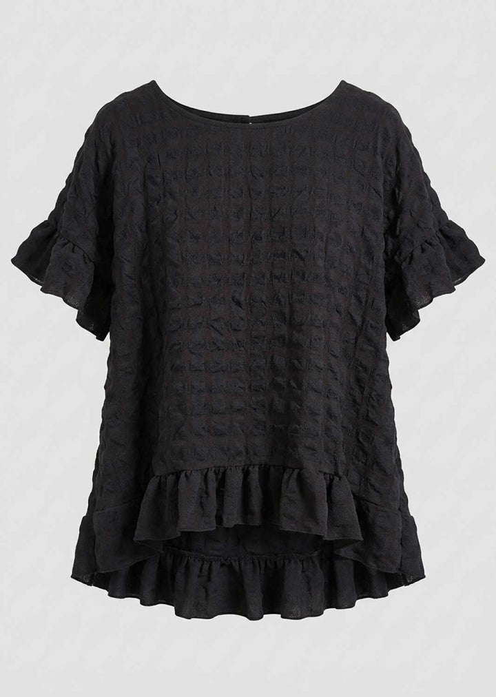 A black textured seersucker short-sleeve blouse with ruffled sleeves and a ruffled asymmetrical hem, shown against a plain light gray background.