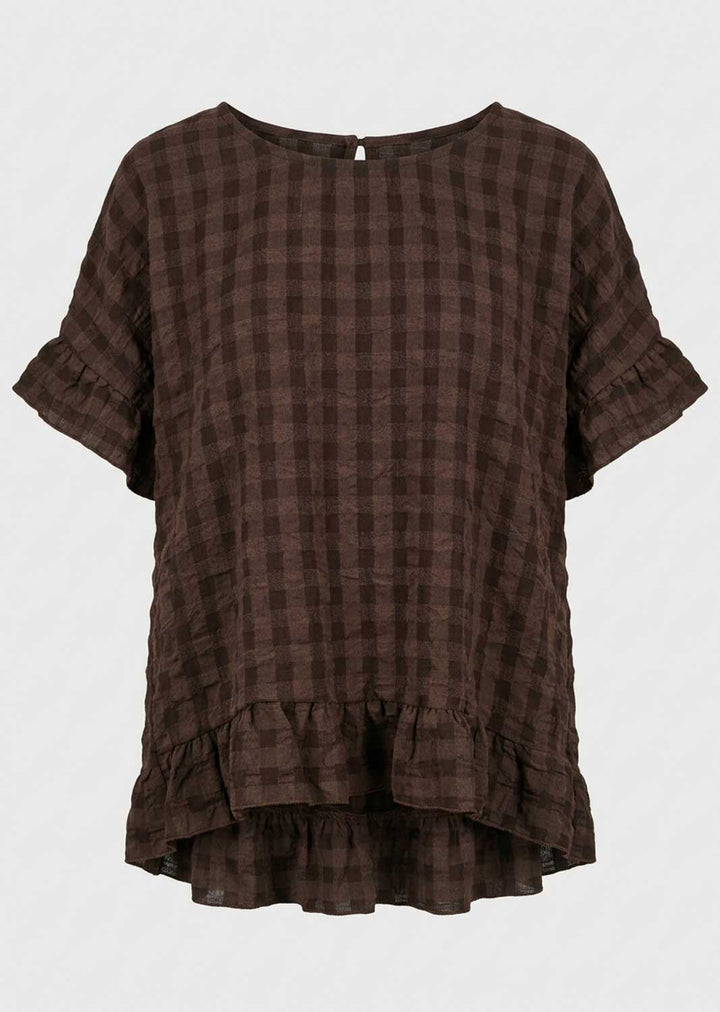 A dark brown checkered short-sleeve top with ruffled details, displayed against a light gray background.