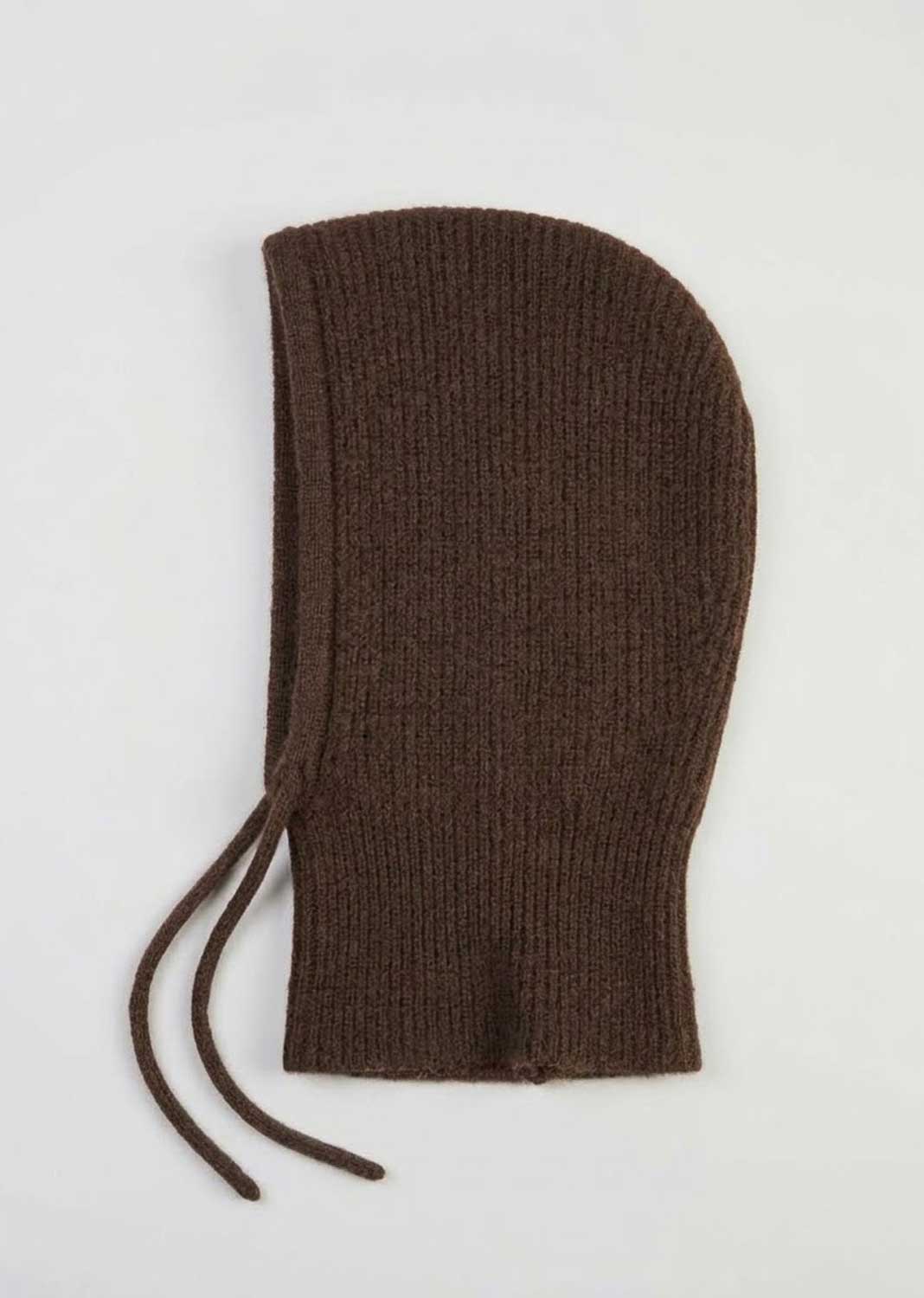 A dark brown ribbed knit bonnet with drawstrings, laid flat on a light gray background.