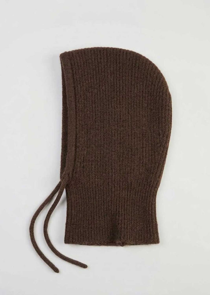 A dark brown ribbed knit bonnet with drawstrings, laid flat on a light gray background.