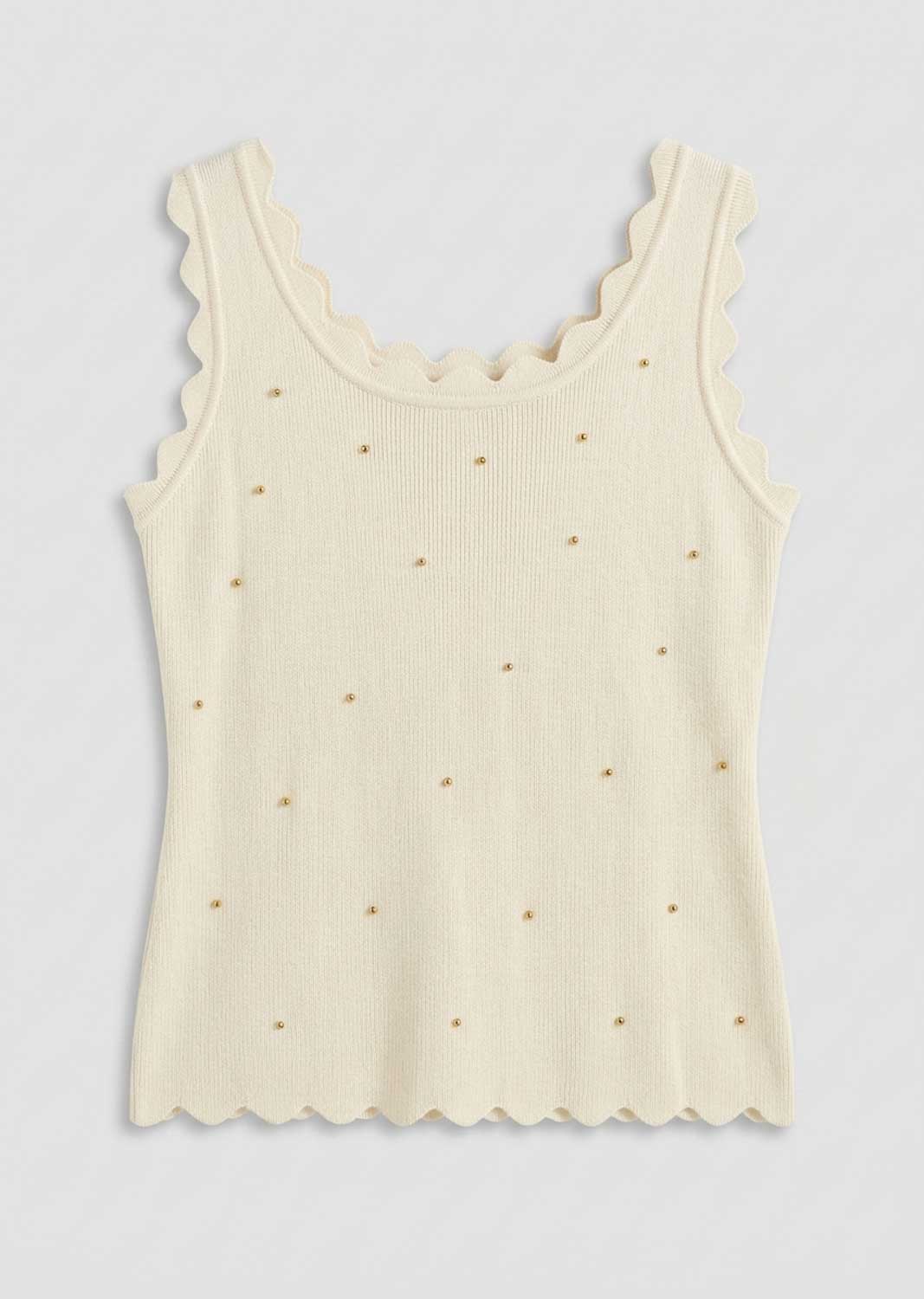 An off-white ribbed knit tank top with scalloped edges on the scoop neck and hem, decorated with small scattered gold embroidered dots, shown against a light gray background.