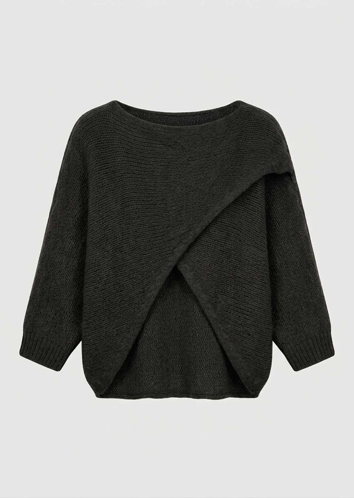 A dark charcoal gray knit sweater with a wide boat neckline and an asymmetrical draped wrap design on the front, shown against a light gray background.