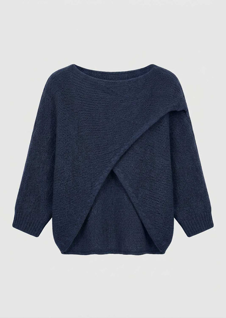 A navy blue knit sweater with a draped, asymmetrical wrap design on the front, displayed against a light gray background.