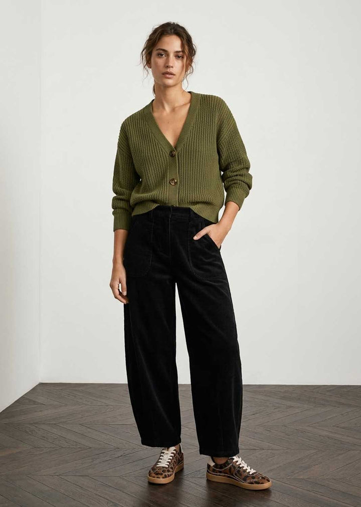 olive green button cardigan.black jumbo cord pants