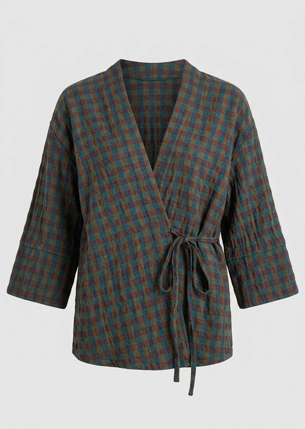 A plaid wrap jacket with three-quarter sleeves and a self-tie belt, featuring a textured fabric in dark green and brown tones, shown against a plain light gray background.