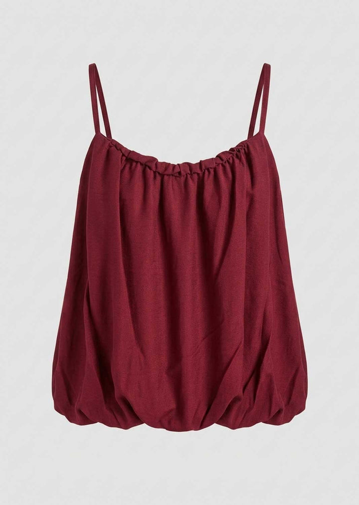 A burgundy spaghetti-strap top with a gathered, balloon-like silhouette
