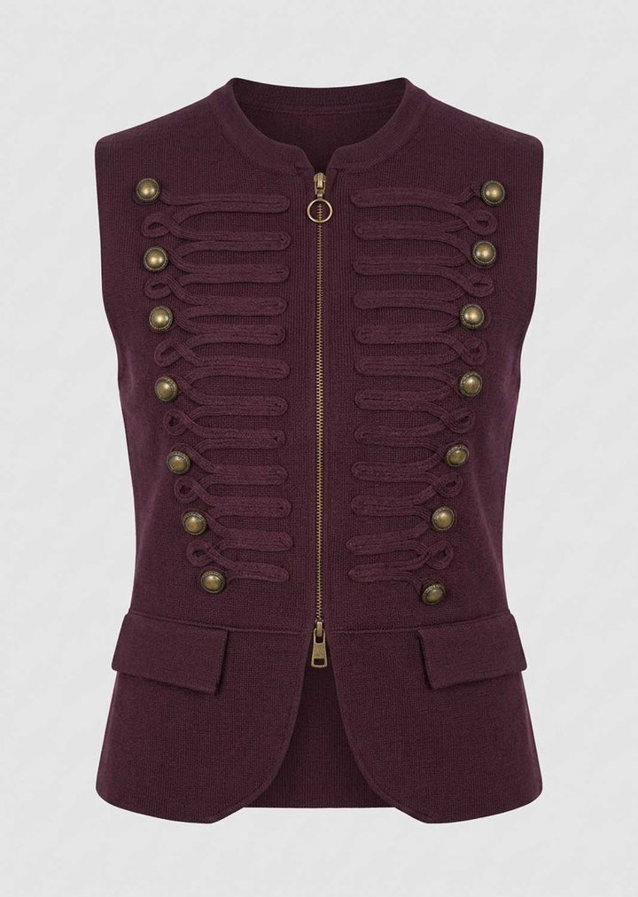 A sleeveless, structured military-style vest in deep burgundy, featuring a central gold zipper, decorative gold-tone buttons, and ribbed detailing on the front, set against a light gray background.