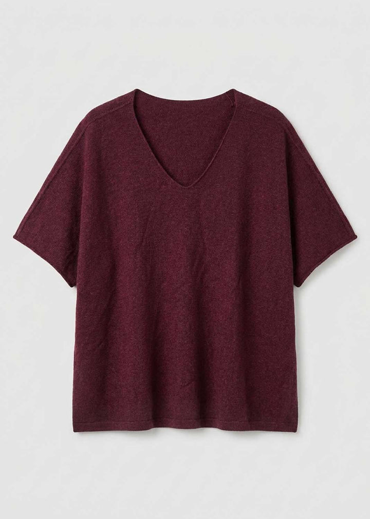 A short-sleeve V-neck knit top in a heathered burgundy color, displayed flat against a light gray background.