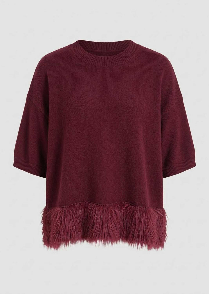 A dark burgundy knit sweater with a fuzzy faux-fur trimmed hem, shown against a plain light gray background.