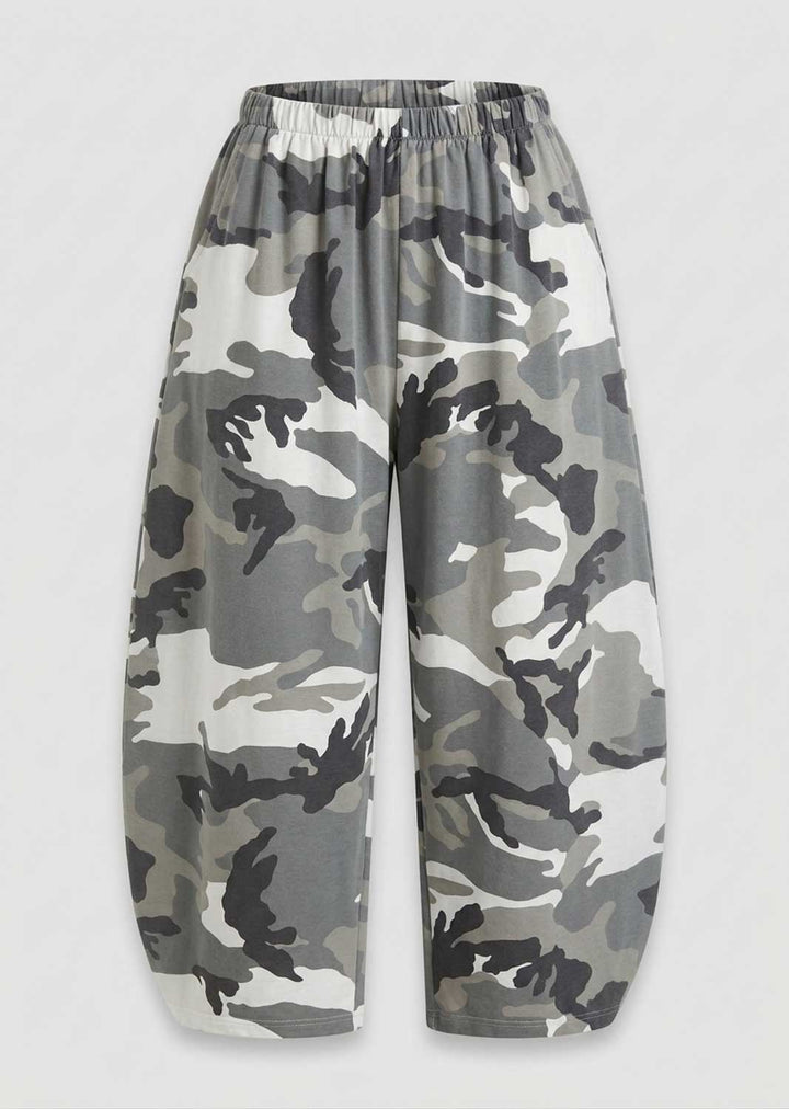 A pair of wide-leg trousers featuring a gray, black, and off-white camouflage pattern, displayed against a light gray background.