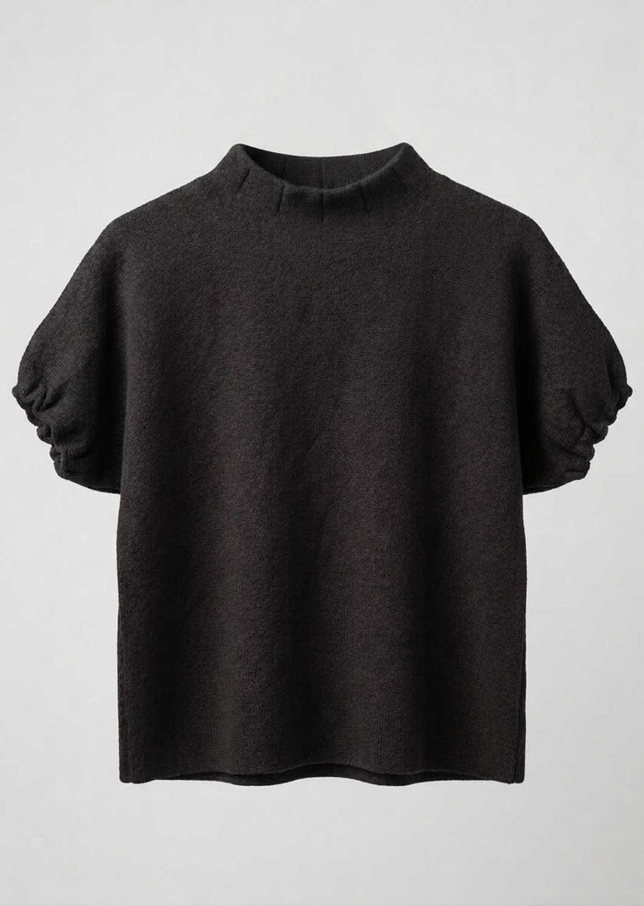 A dark brown knit short-sleeve top with a mock neck and voluminous puff sleeves, shown against a light gray background.