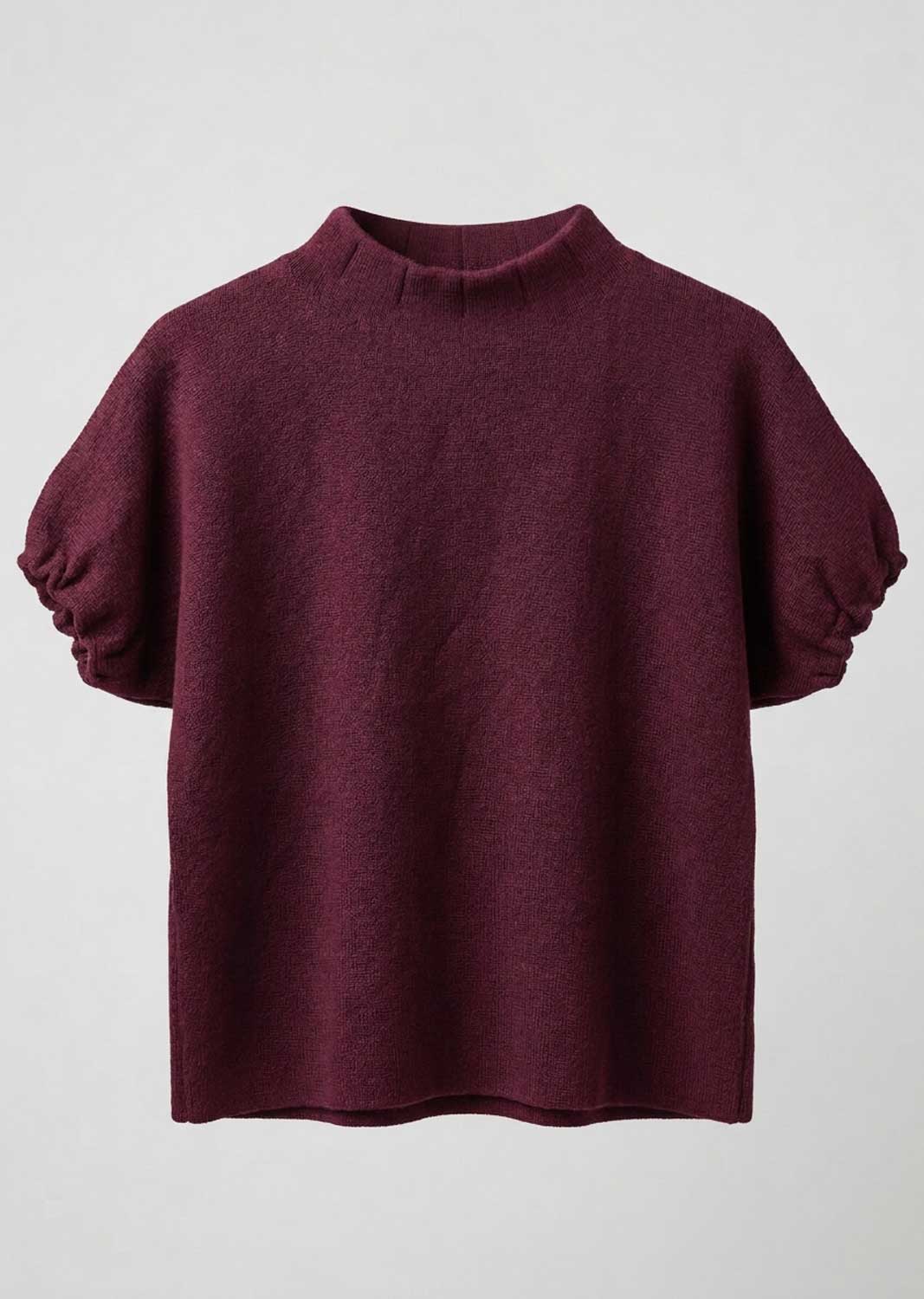 A short-sleeve knit top in deep burgundy with a mock neck and voluminous elbow-length sleeves, shown against a light gray background.