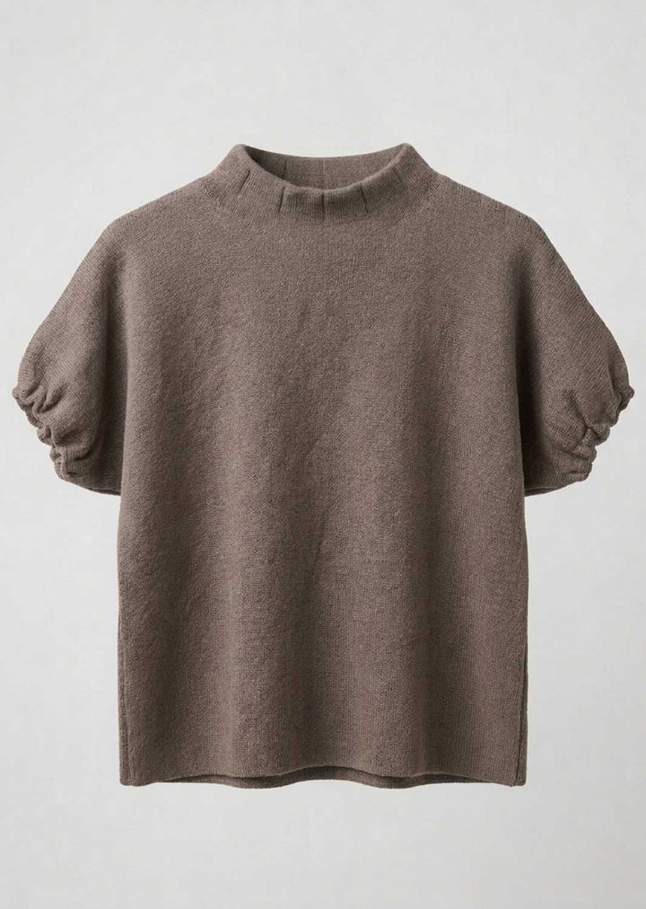 A taupe brown knit top with a mock neck and voluminous elbow-length puff sleeves, shown against a light gray background.