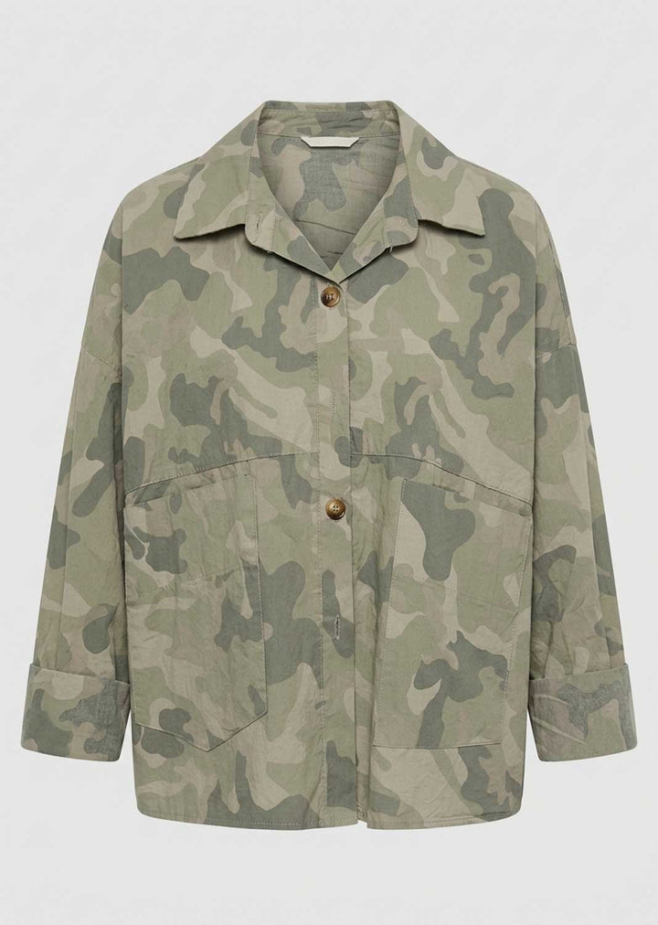 A long-sleeve utility jacket featuring a muted green and beige camouflage pattern, with a pointed collar, two front button closures, and two large front flap pockets, shown against a plain light gray background.