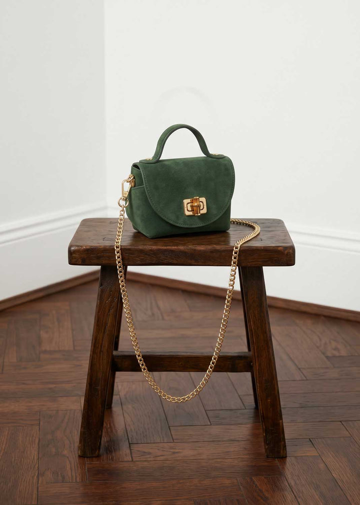 mini suede bag and gold chain
