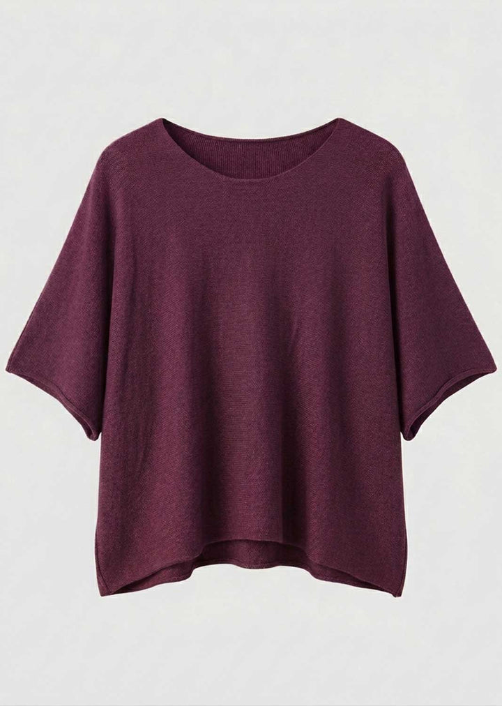 A short-sleeve, boat-neck knit top in a deep plum or burgundy purple, displayed flat against a light gray background.
