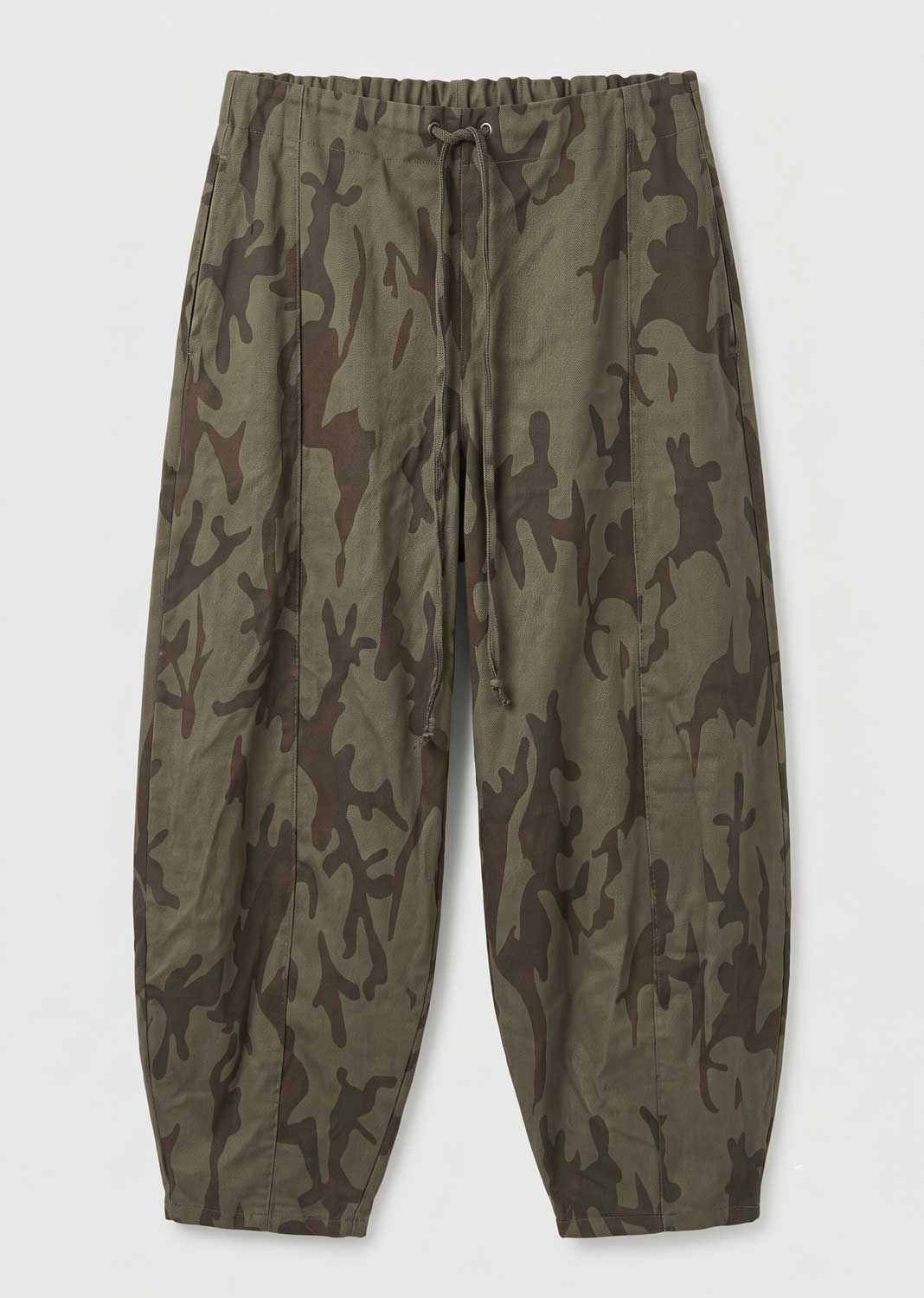 A pair of relaxed-fit camouflage pants in olive green and brown, featuring an elastic drawstring waist and tapered legs, shown flat against a light gray background.